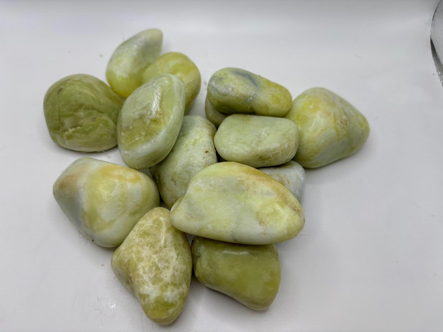 Greenish stones on a white surface