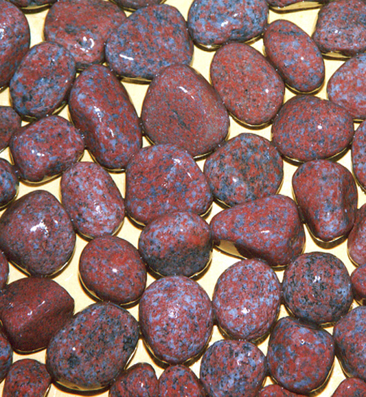 Pink Granite Pebbles on a yellow background