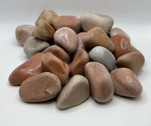 Assorted colored stones on a white background